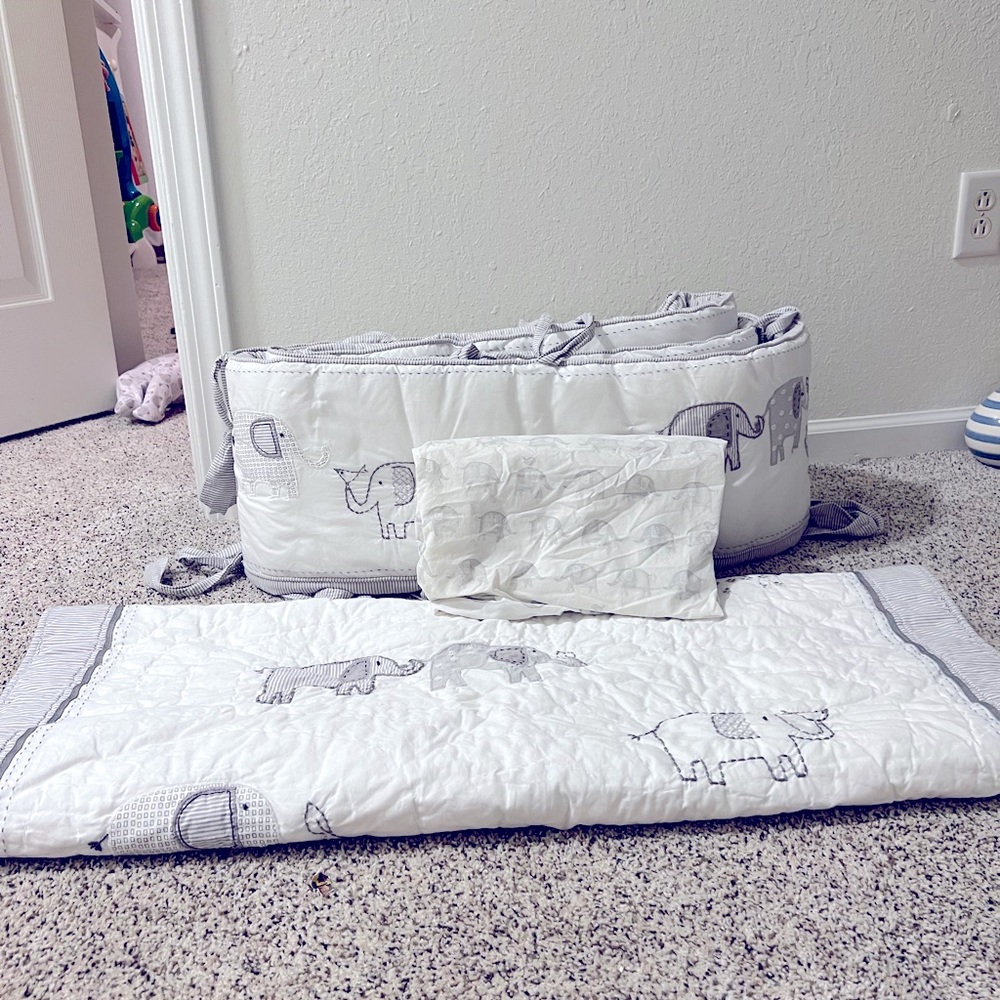 Pottery barn crib bedding. Includes sheet bumper pad and blanket